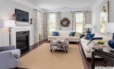 Stylish and practical! Lovely gas FP with Italian slate hearth. Bold crown and beauty molding continues into this room. Plenty of space to entertain for the big game or family movie night. The popcorn is just a step or 2 away!
