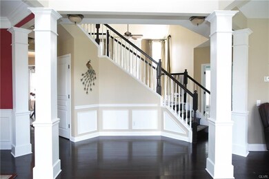Enter into the grand 2 story foyer