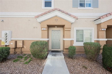 Entrance to property with stucco siding