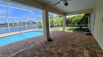 Outdoor pool featuring glass enclosure, a patio, a