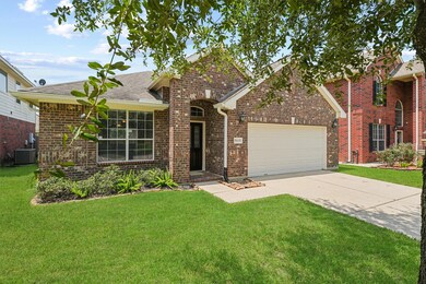 The inviting front entrance is framed by beautiful brickwork and a quaint front porch. The large front window allows plenty of natural light to brighten the dining space inside, creating a warm and welcoming atmosphere.