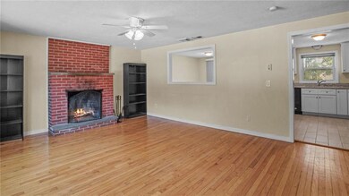 Living room with brick fireplace