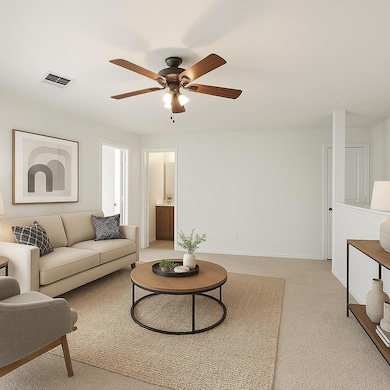 Living room with light carpet and ceiling fan