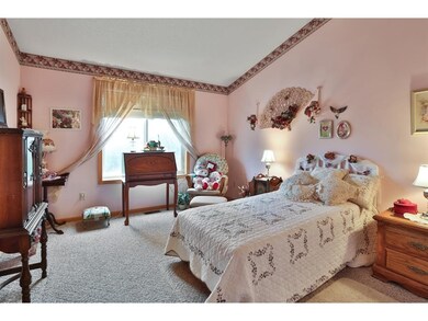 The upper level bedroom features a walk-in closet,