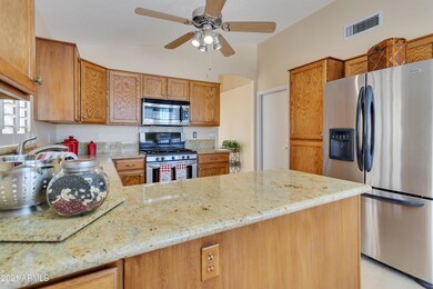 Kitchen features dual fuel gas range, slide-outs in some cabinets and bottom of pantry, decorator knobs, French door refrigerator with water and ice and pantry, to name a few.