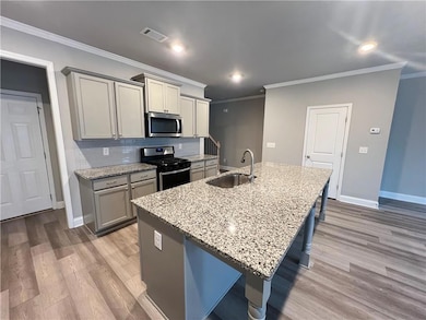 Kitchen featuring appliances with stainless steel 