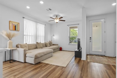 Living area with recessed lighting, wood finished