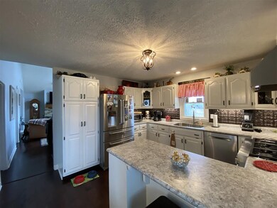 Kitchen with bar seating .