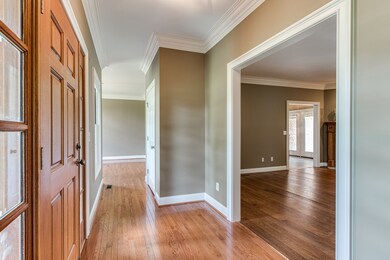 A large foyer spans the front of the home and features convenient double closets for storage or coats.