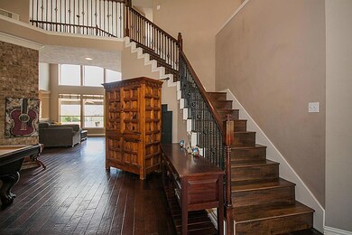 Wood stairway with wrought iron.