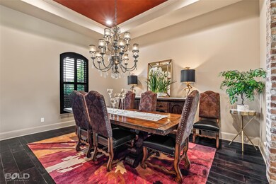 Dining space with a raised tray ceiling, crown mol