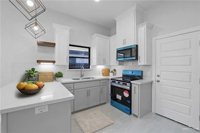 staged. Example only. Range oven and microwave vent included!