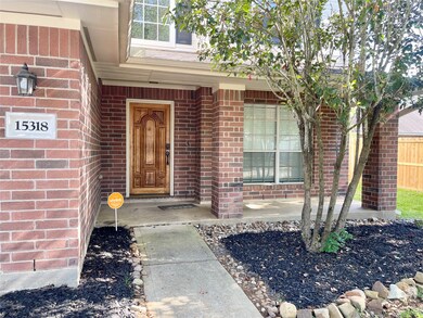 Charming brick home with a welcoming front porch a
