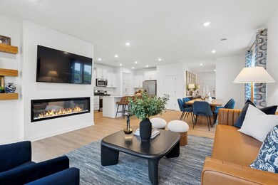 (Photo of decorated model, actual homes colors and finishes will vary) The spacious and open-concept main level allows for optimal versatility and comfort.