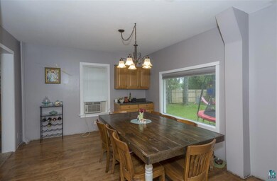 Extra storage cupboard space by large picture wind