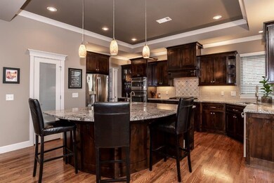 Large kitchen island with prep sink and storage
