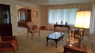 Elegant Living Room with Picture Windows.