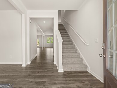 halton front entryway open foyer with access to the staircase and flex room