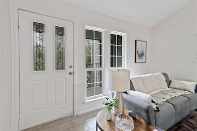 Living room featuring tile patterned floors and a 