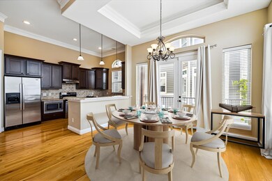 Virtually staged dining area.The tray ceiling in t