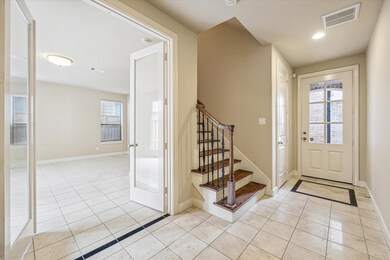 FOYER… Bright and inviting entryway has ceramic ti