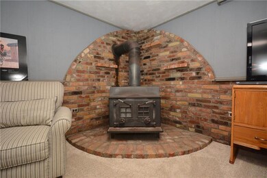 Wood Burner in Lower Level Family Room.