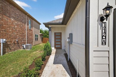 View of side of property featuring board and batten siding and a central air condition unit