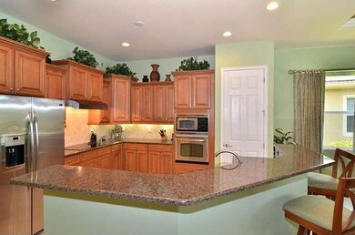 Open granite/stainless kitchen also has golf views