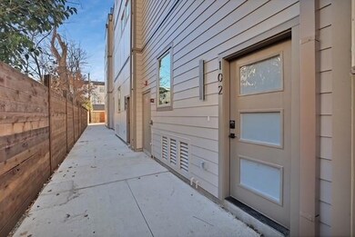 View of exterior entry featuring a patio and fence