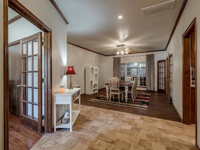 Dining room featuring crown molding, recessed lighting, a ceiling fan, and light wood-style flooring