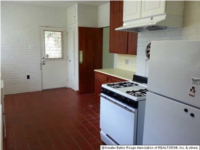 Kitchen with dishwasher, stove, and fridge