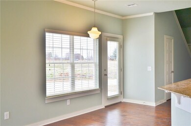Eat-in Kitchen area with door to side patio.