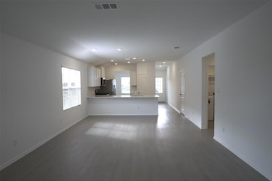 Unfurnished living room featuring dark wood-style