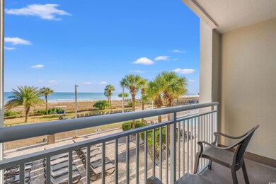 Balcony with a view of the beach and a water view
