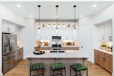 Kitchen with light wood-type flooring, a kitchen 