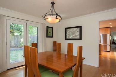The dining room French doors look out to the back 