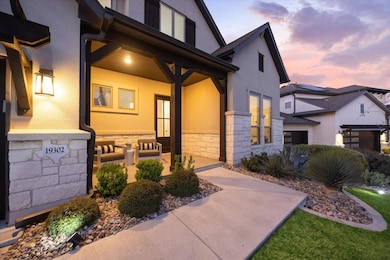 Entrance to property featuring stone siding and s