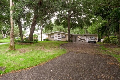 Large front yard with extended driveway.