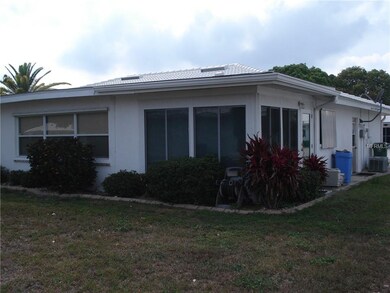 Back yard view of Florida room.