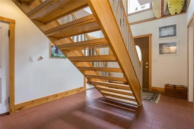 The tiled, two story foyer contains...