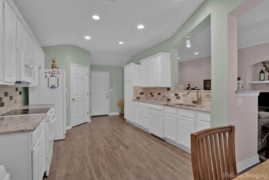 Kitchen with light hardwood / wood-style floors, w