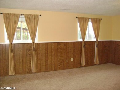 Den/Family/Great Room - LOTS of space with its own half bath and separate rear entrance.