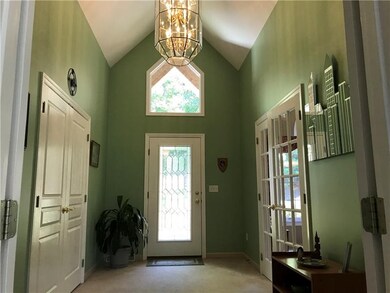 Gracious entry with cathedral ceiling, leaded glas