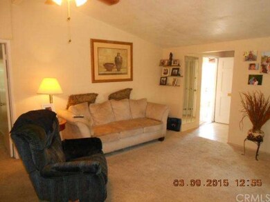 The spacious living room has vaulted ceilings, a c