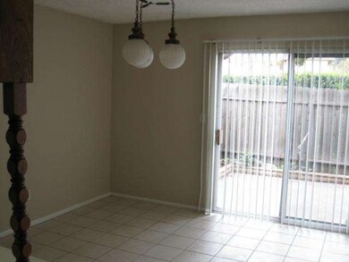 Dining area next to kitchen with sliding glass doo
