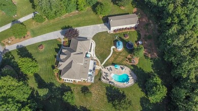This Custom built home is a rare find! Nestled on over 3 acres, this home boasts wooded privacy yet situated in a quiet neighborhood. Gorgeous salt water Pool and Huge RV Storage!