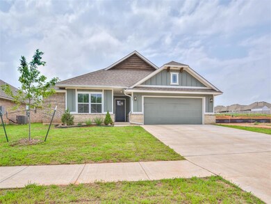 Craftsman inspired home with a garage and a front 