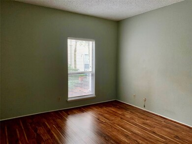 This room features a single window with blinds, wo