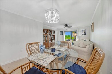 Dining space with crown molding and ceiling fan wi