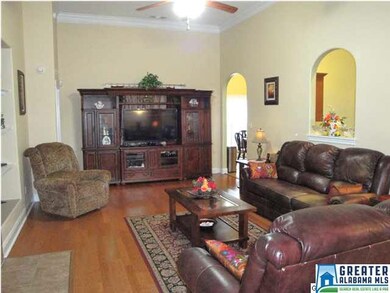 Open living room complete with gas log fireplace a